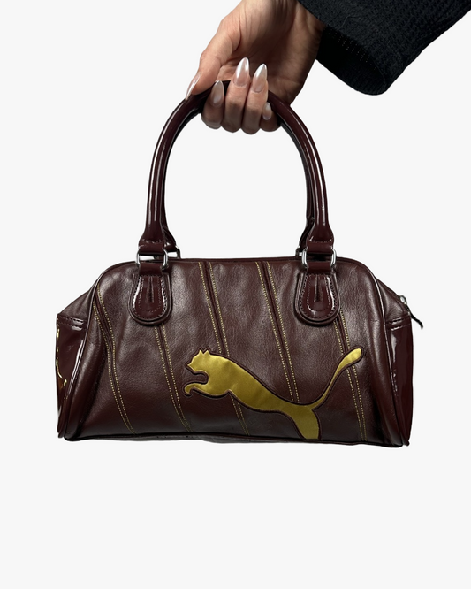 BURGUNDY AND GOLD PUMA LEATHER BAG